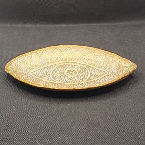 Eye spirt bronze dish.